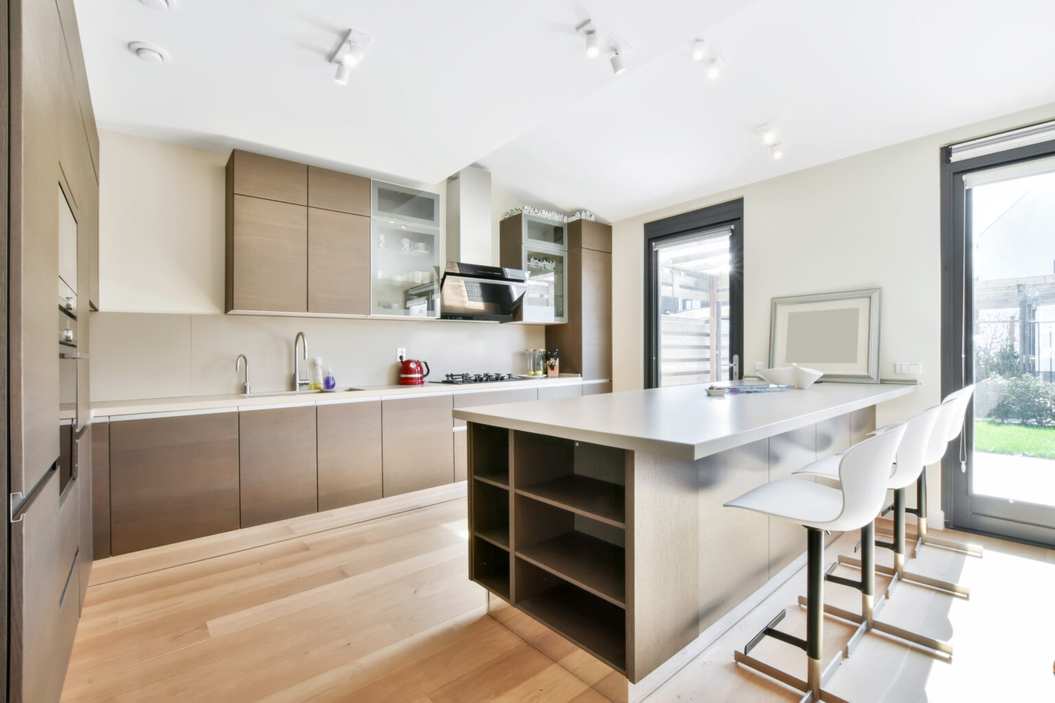 Luxurious kitchen from the island in a modern style and with all the necessary equipment for cooking