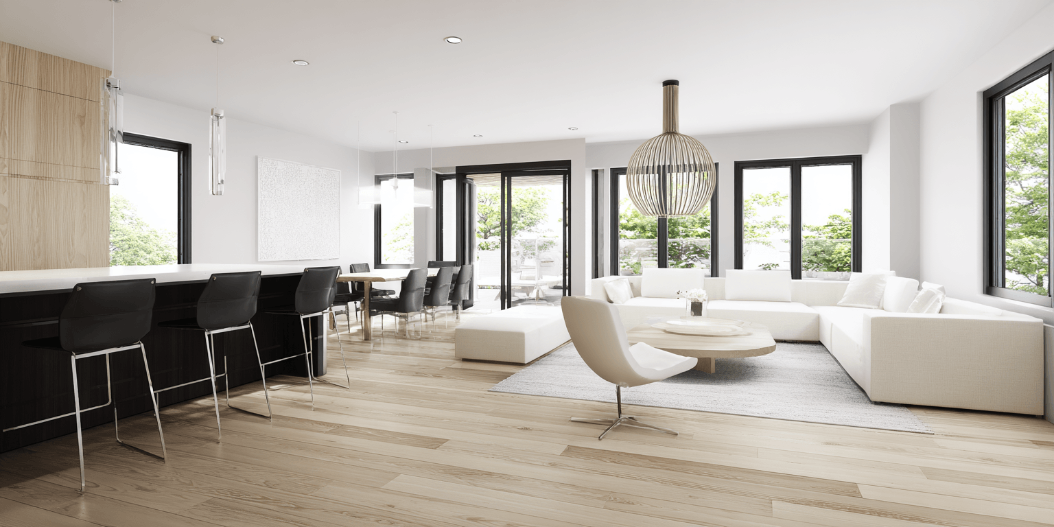 Modern basement renovation in Toronto featuring an open-concept layout, light wood flooring, minimalist furniture, and large windows for a bright and airy space.