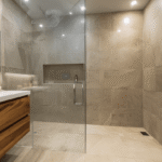 Bathroom renovation Toronto modern walk-in shower with large tiles, glass enclosure and wood vanity design
