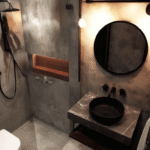 Small bathroom renovation Toronto featuring compact layout, walk-in shower, and modern loft-style design